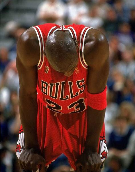 Michael Jordan Hangs His Head In Exhaustion And Tugs At His Shorts
