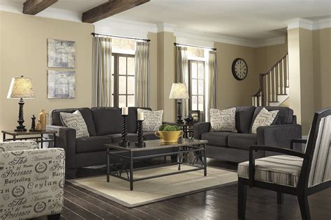 Complement the richness of earthy brown, black and dark grey carpeting with even more drama. light gray couch living room ideas | ... Laminate Wood ...