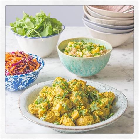 Just before serving, gently mix the potatoes into dressing, along with red pepper. Coronation Potatoes With Mango, Raisins and Almonds - DeliciouslyElla | Delicious salads, Food ...