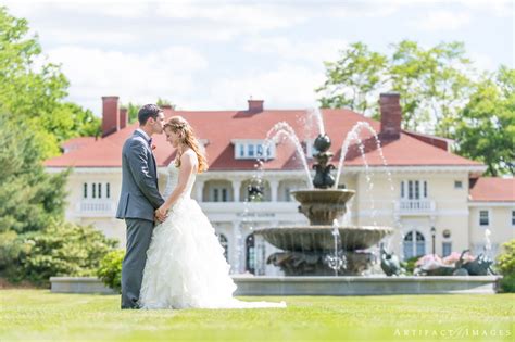 Bride And Groom Portrait At The Lovely Fountain On The Grounds Of