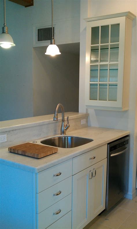 Our kitchen design and install teams are ready to help you update your cabinets today! After Kraftmaid Cabinets (Canvas Color) New Faucet, Sink & Lighting | Kitchen flooring ...