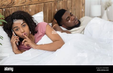 African Woman Cheating On Her Husband Talking With Lover Stock Photo Alamy
