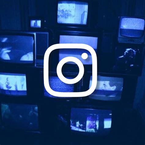 An Instagram Logo Is Displayed On Several Televisions In A Dark Room