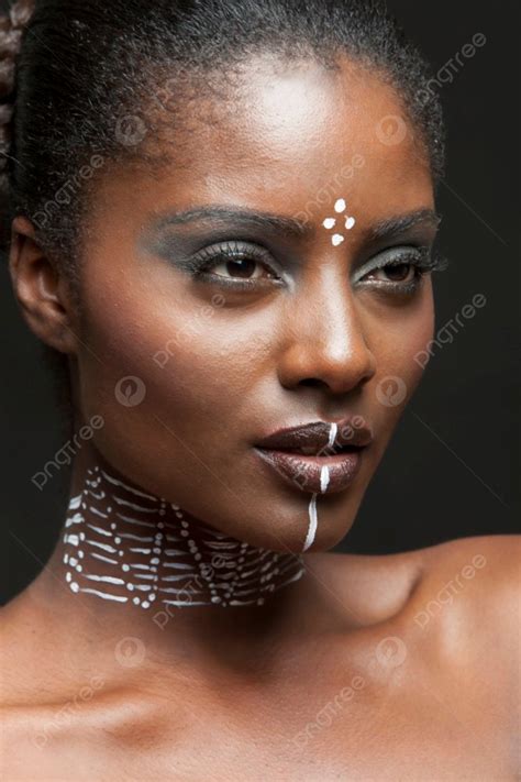 Portrait Of Young African American Woman With Traditional White Paint