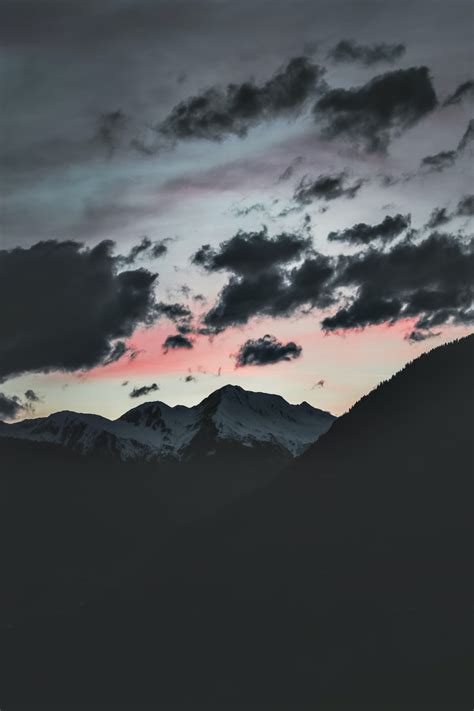 Silhouette Of Mountain Under Cloudy Sky Photo Free Grey Image On