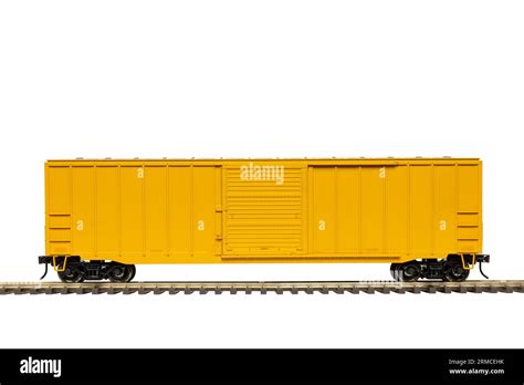 A Yellow Railroad Boxcar On Railroad Track Stock Photo Alamy