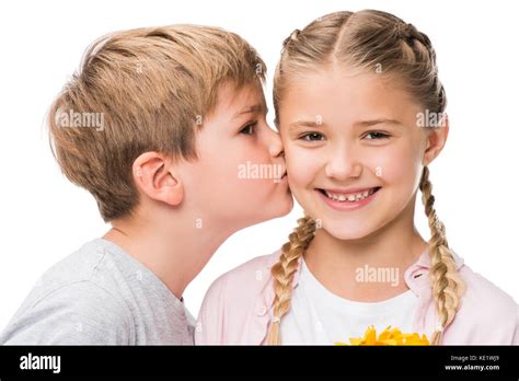 Close Up Portrait Of Cute Little Boy Kissing Happy Girl Isolated On