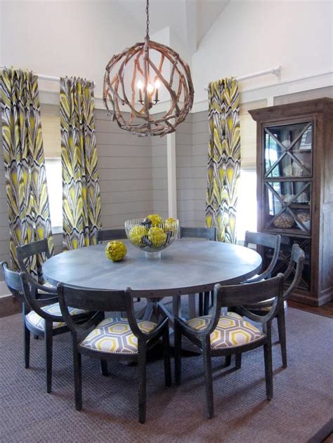 Whether installed above a dining room table, in a foyer or in a lobby, a sparkling chandelier will brighten anyone's day or night. Gray Transitional Dining Room With Driftwood Chandelier | HGTV