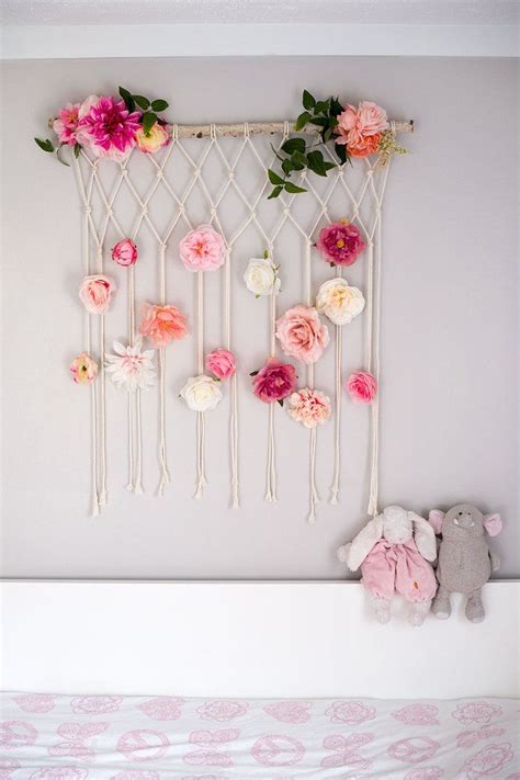 The colors and the patterns of these giraffes are so cute and proving to be the perfect thing to hang onto an empty wall above your baby boy's crib. Macrame Flower Wall Hanging Baby Room Baby Girl Nursery Wall Decor | Hanging flower wall, Flower ...