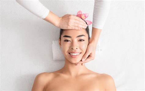 Relaxing Massage Beautiful Asian Woman Enjoying Beauty Treatments At Spa Salon Stock Image
