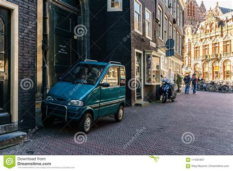 Amsterdam Netherlands March 20 2018 Tiny Car On Narrow Street Of