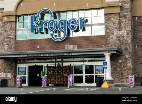 A Logo Sign Outside Of A Kroger Retail Grocery Store Location In