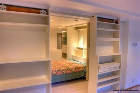 It features a sliding barn door wall, mindi and mahogany solids and veneers, and adjustable shelves for smart, flexible storage. Sliding Secret Bookcase Door Divider Panel | StashVault