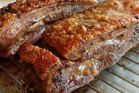 Marinated in a sherry honey glaze, then roasted to perfection, this dish will have you 'pigging out' to your heart's content! original recipe yield: Chinese Crispy Roasted Pork Belly (燒肉 - Siu Yuk) Recipe on ...