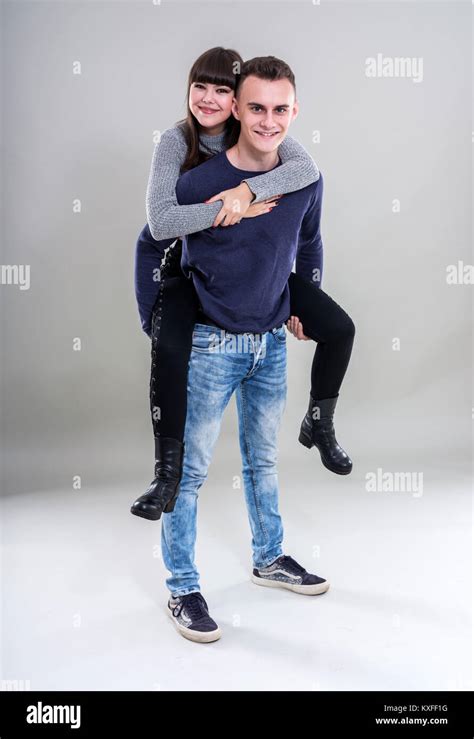 Teenage Boy Giving His Girlfriend A Piggyback Ride Stock Photo Alamy