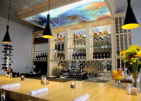 Decorative Ceiling Tiles Backlit graphic panel over a bar on the