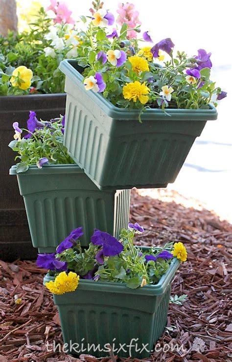 For your tall flowers small flowerpots and vases just will not do. tiered-flower-pots.jpg