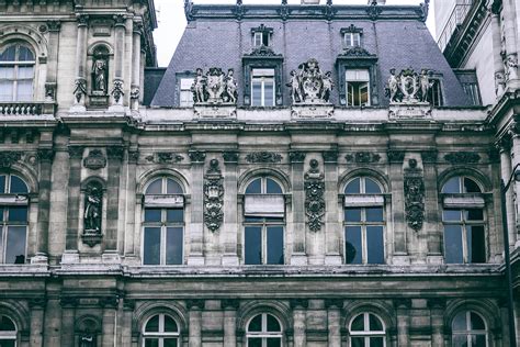 Facade Of Typical Classic French Building With Sculptures · Free Stock