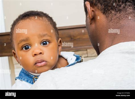 Black Man Holding Baby Hi Res Stock Photography And Images Alamy