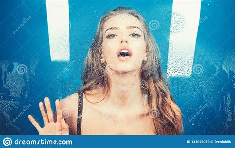 Woman Behind Plastic Sheet With Water Drops Shower And Hygiene Spa Treatment Window With Water