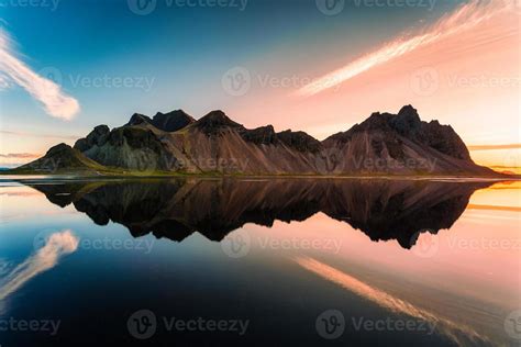 Sunrise Over Vestrahorn Mountain Range And Water Reflection In Viking