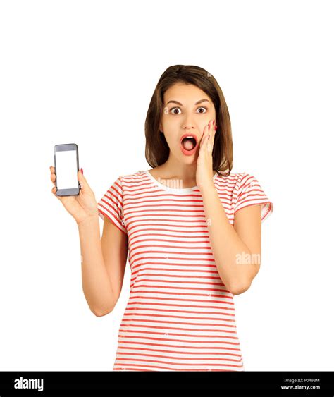 Portrait Of A Shocked Girl With An Open Mouth Showing A Blank Mobile