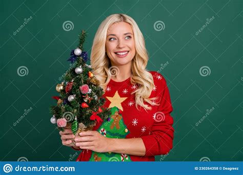 photo of cheerful positive happy woman dream look empty space hands tree on green color
