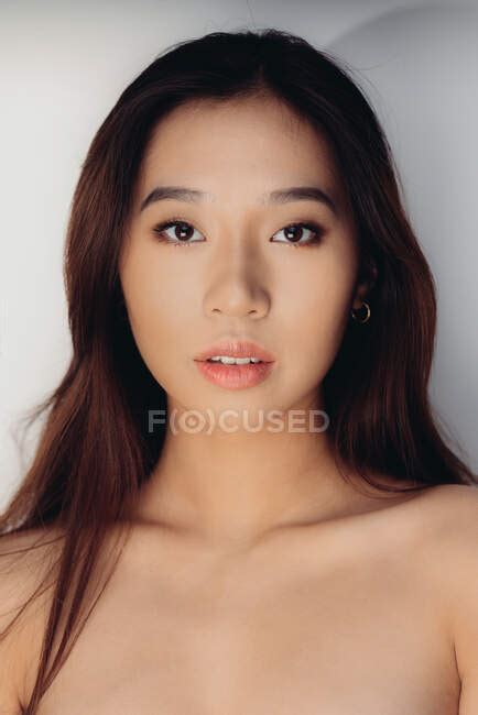 Portrait Of Naked Young Chinese Woman Looking At Camera Over White Background — Sensual Asia