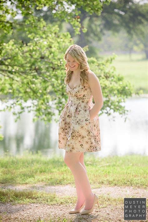 Senior Portraits Of A Blonde Female High School Girl Wearing A Floral
