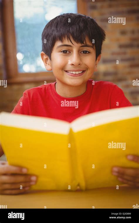Boy Reading Book In Library Hi Res Stock Photography And Images Alamy