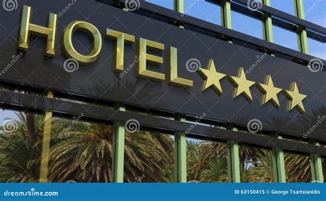 Metallic Glass Hotel Sign Board With Four Golden Stars Stock