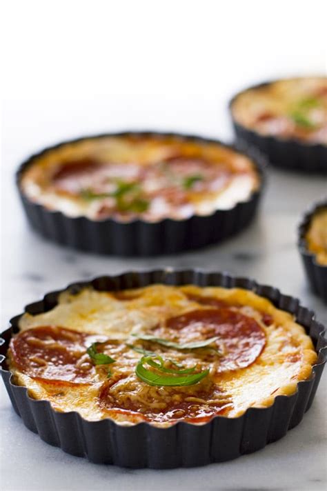 Fill with rice, beans, or ceramic pie weights and bake the pie shell for about 15 minutes, or until the edges are just golden. Pie Crust Pizza Tarts - Baking Mischief