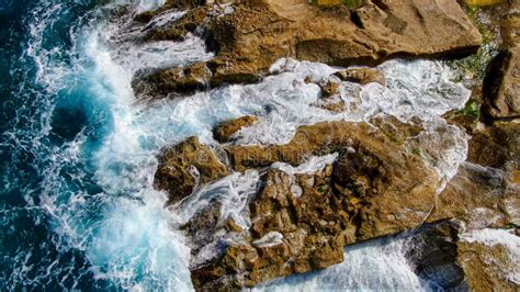 Wild Ocean Water From Above Waves Hitting The Rocks Stock Image