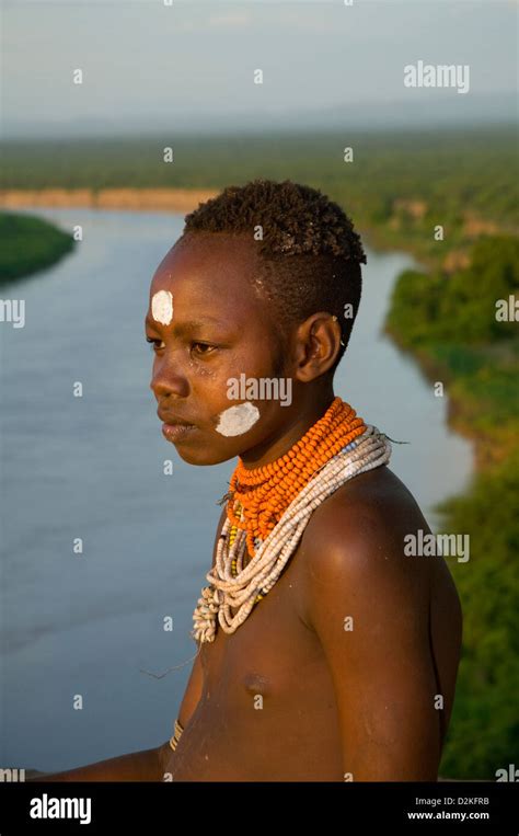 Portrait Of Decorated Kara Woman On Bluff With Omo River Below Close Up