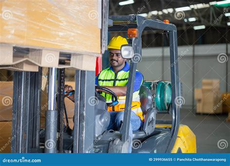 Worker Driver At Warehouse Forklift Loader Works To Containers Box