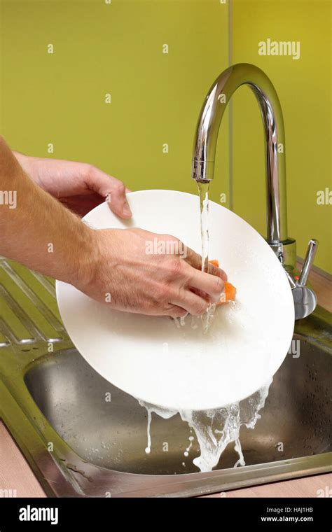 Washing Dishes In The Kitchen Stock Photo Alamy