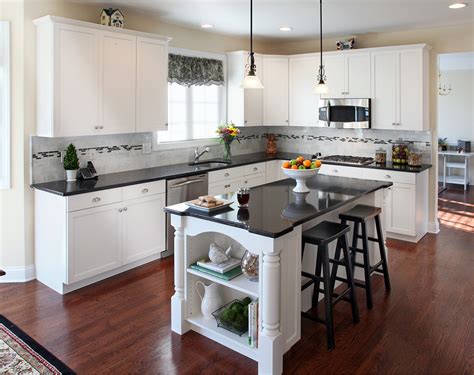 White cabinets black countertop combinations create a stunning effect regardless of the style of the kitchen. Kitchen Remodels With White Cabinets Pictures | Roy Home ...