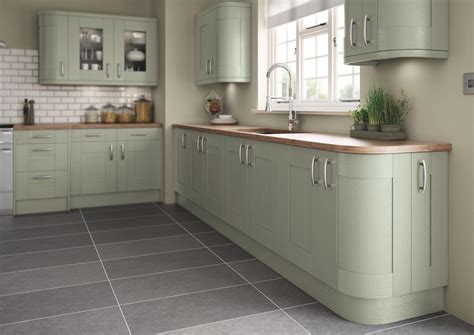This paint color reads as a neutral tone, since it's a pale green with a slight addition of gray. Green painted shaker kitchen | Shaker style kitchen ...