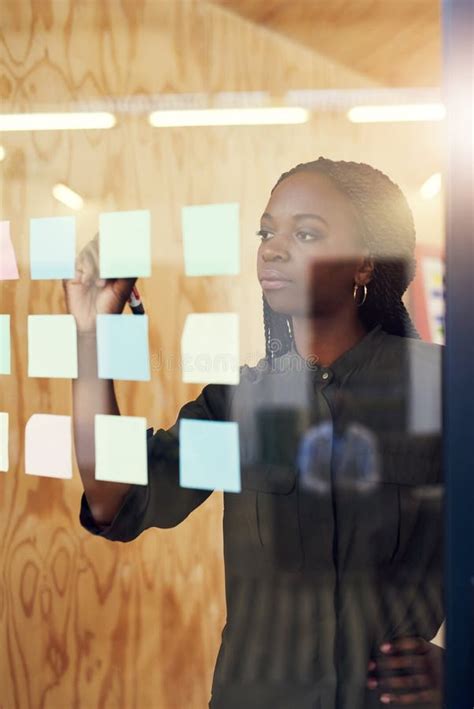 Black Woman Writing And Ideas On Glass At Startup For Brainstorming