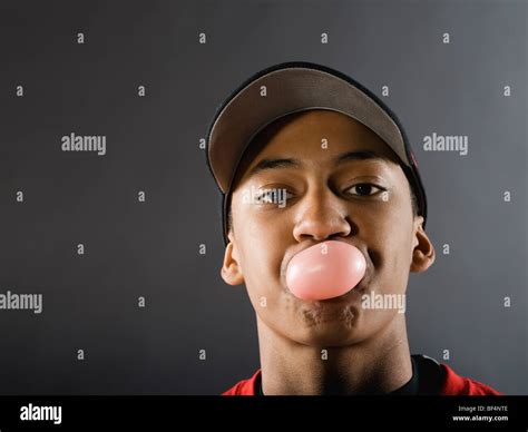Mixed Race Baseball Player Blowing Bubble With Gum Stock Photo Alamy