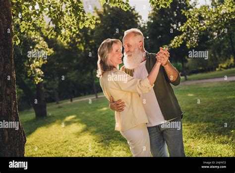 Photo Of Positive Harmony Old Couple Dance Feel Young Trees Green