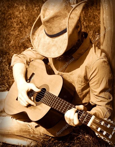 Cowboy Plays Guitar Stock Photo By ©geraktv 75276563