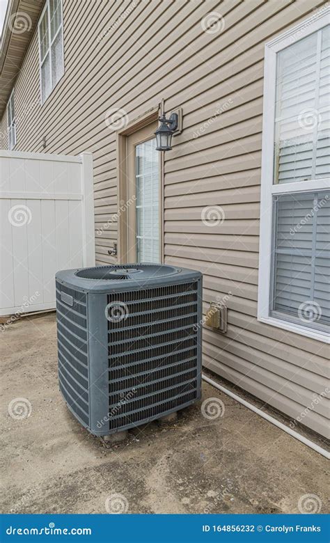 Air Conditioning Unit On Patio Behind Condo Stock Photo Image Of