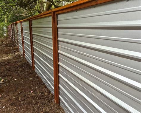 Overlap at least one ridge and drill the steel screws through the panels and furring strips. Galvanized Metal Fence Ideas, Pictures, Remodel and Decor
