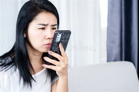 social addiction concept with addicted asian woman forcing her eyes looking at the screen of