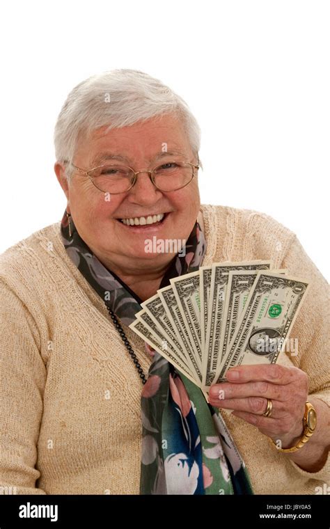 Old Woman Holding Dollars And Laughing Isolated On White Stock Photo