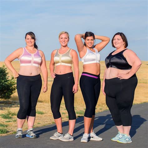 Three Women In Sports Bras Standing Next To Each Other With Their Arms