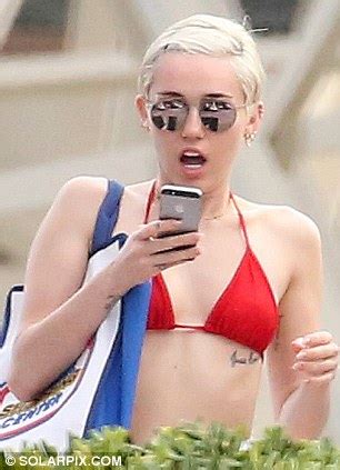 Miley Cyrus Strips Down To Grey And Black Bikini In Barcelona Daily Mail Online