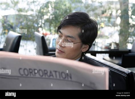 Businessman Reading Newspaper Stock Photo Alamy