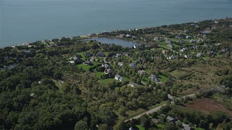 4k Stock Footage Aerial Video Of Flying By Upscale Homes In A Coastal